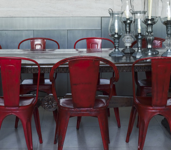 Red metal Chairs and Silver Candles